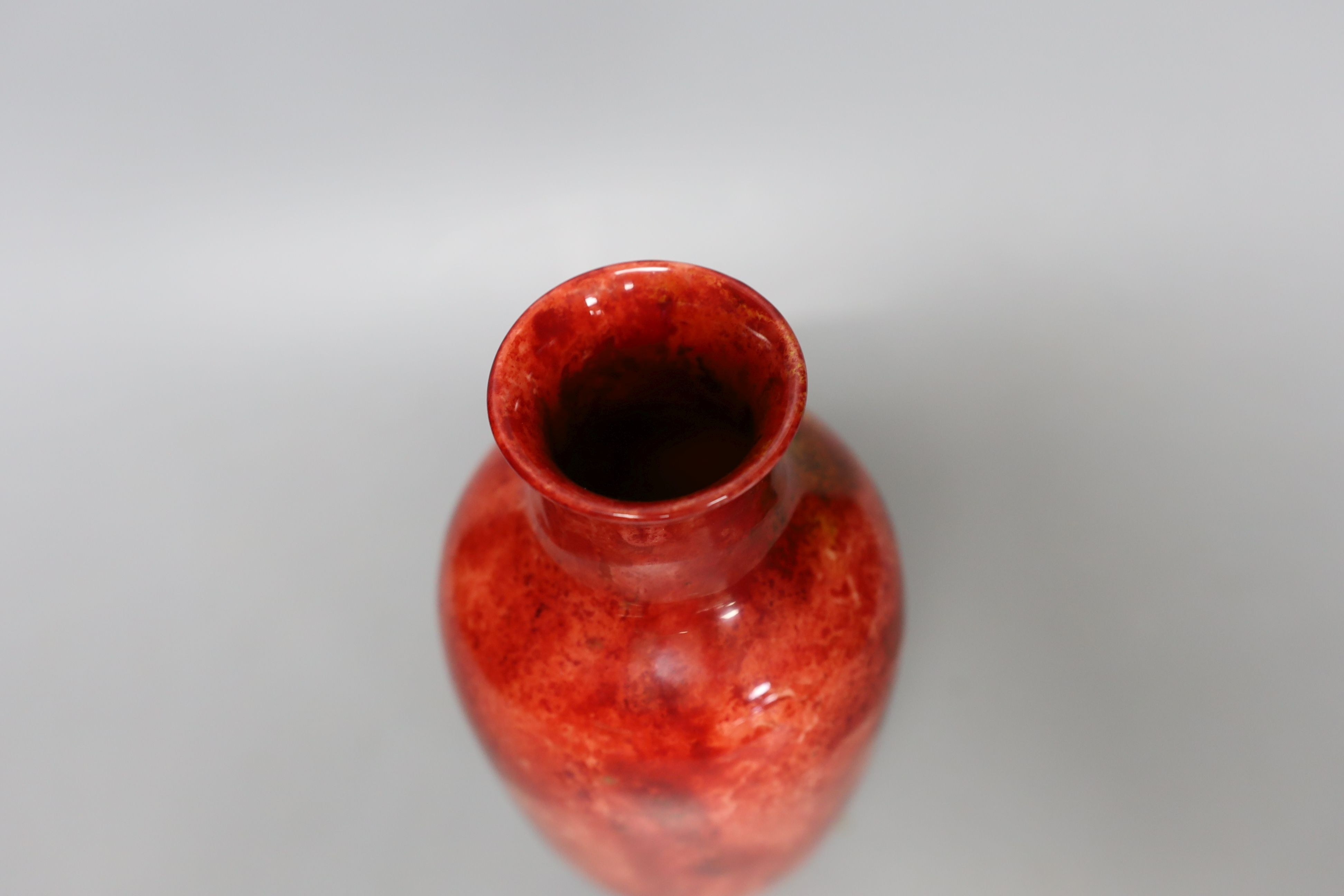 A Doulton flambe vase designed by C.J. Noke, 19cm tall